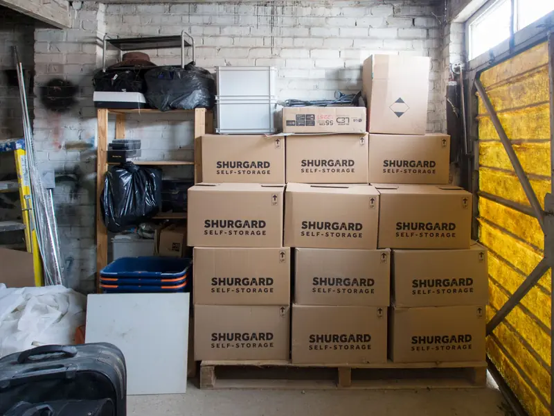 A stack of storage boxes in a well-organized warehouse interior
