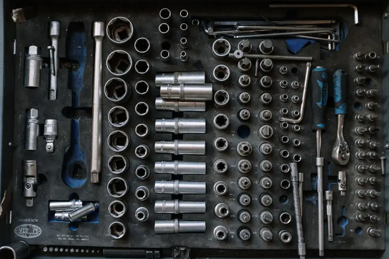 Flat lay of a complete toolset neatly organized in a workshop setting, essential for auto repair tasks