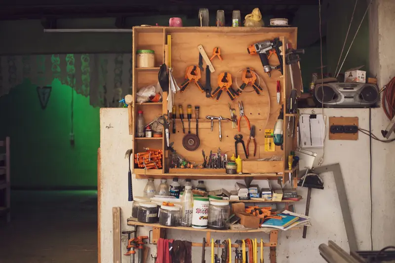 A detailed view of an organized workbench with tools in a traditional Mexican carpentry workshop